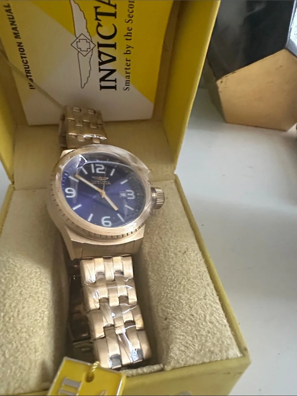 Invicta Gold watch, deep blue face